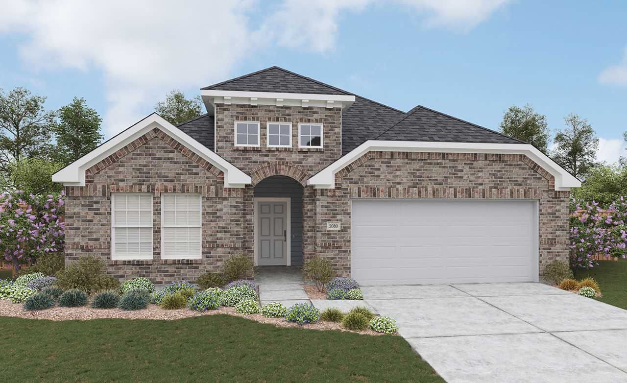 Modern brick house with arched entry, gabled roof, surrounded by shrubs, at Creeks Crossing neighborhood.