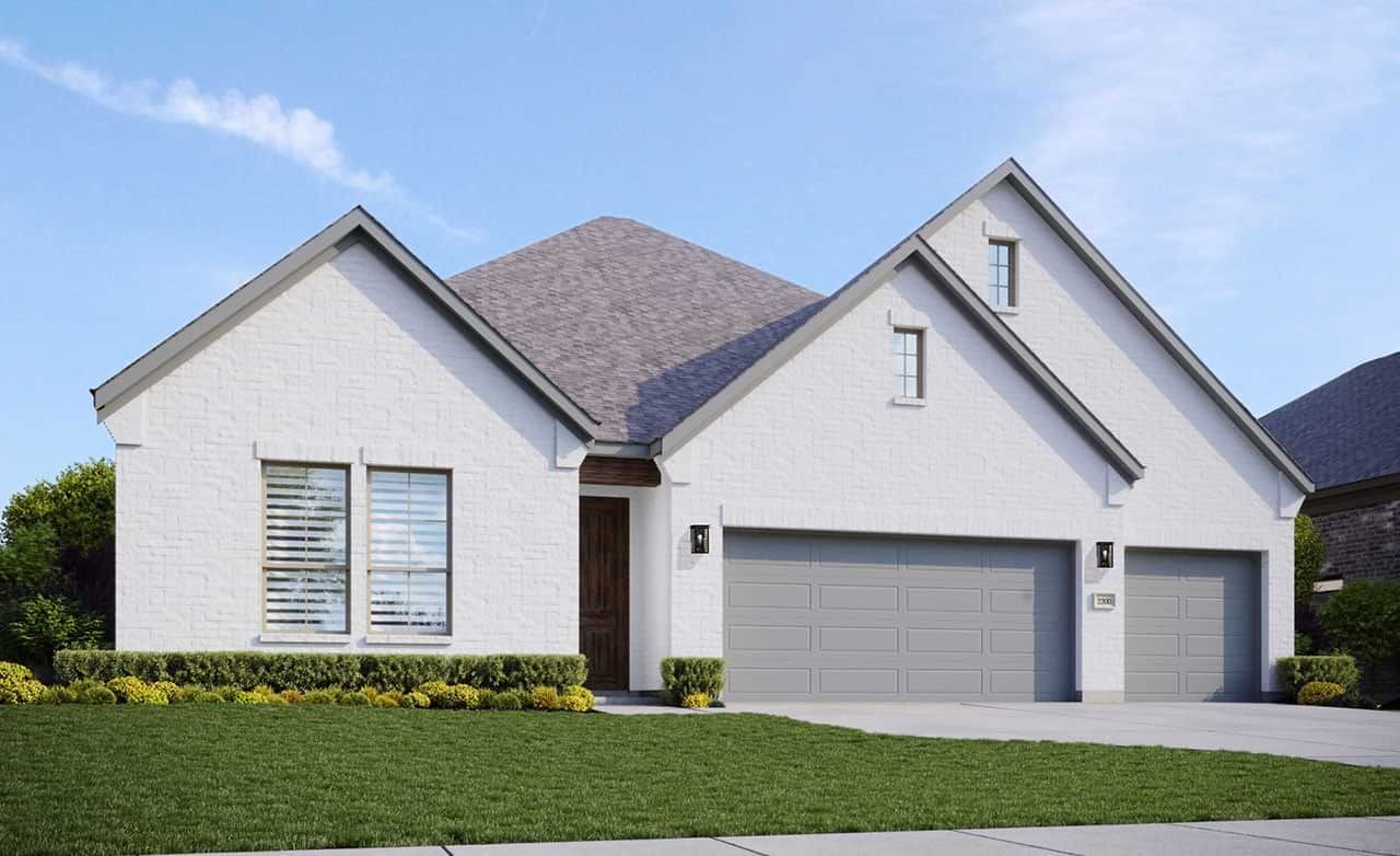 Modern white brick home with manicured lawn, large windows, three-car garage in Retreat at San Gabriel.