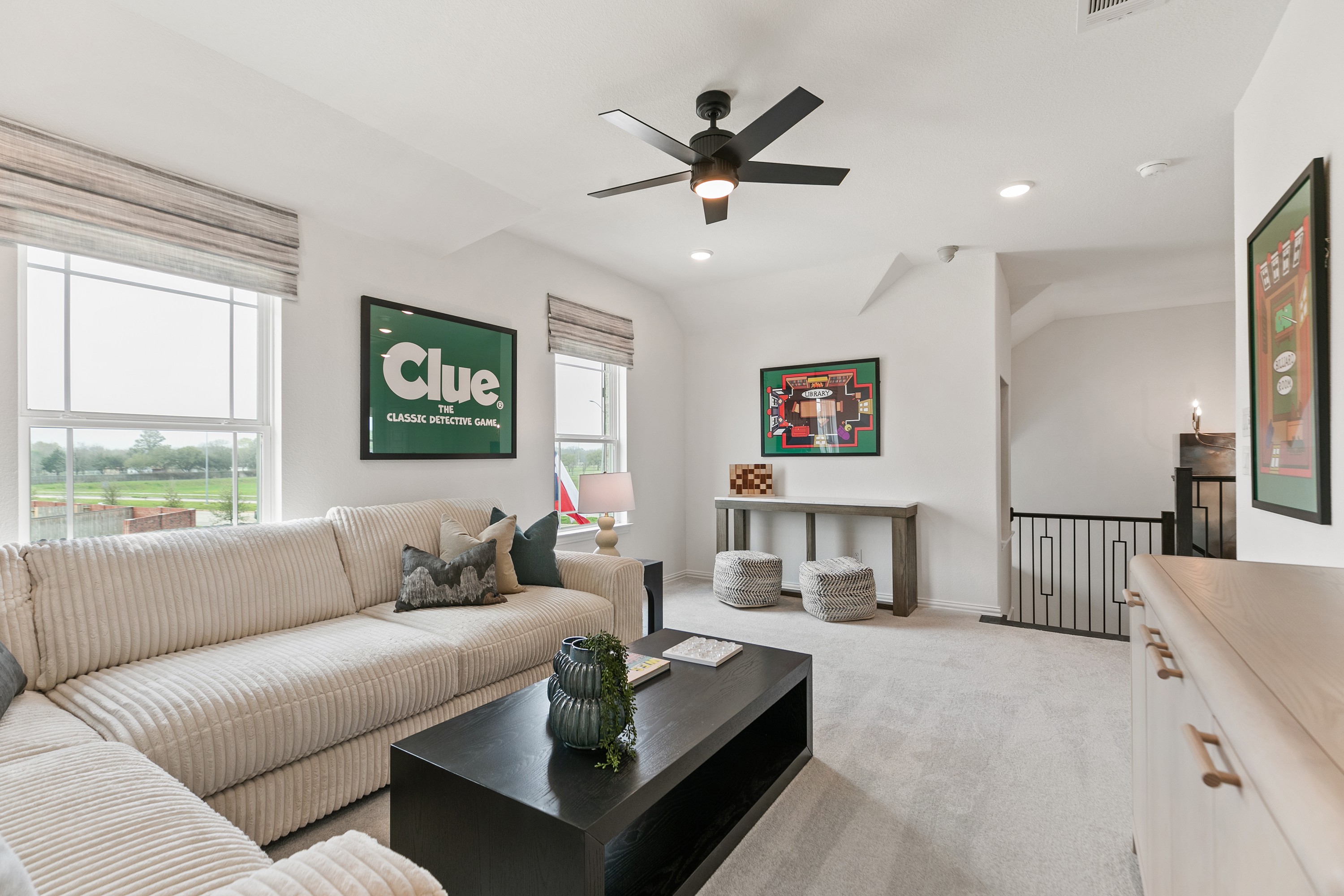 Modern living room with elegant decor, framed art, and plush seating in Park at Eldridge, Houston.