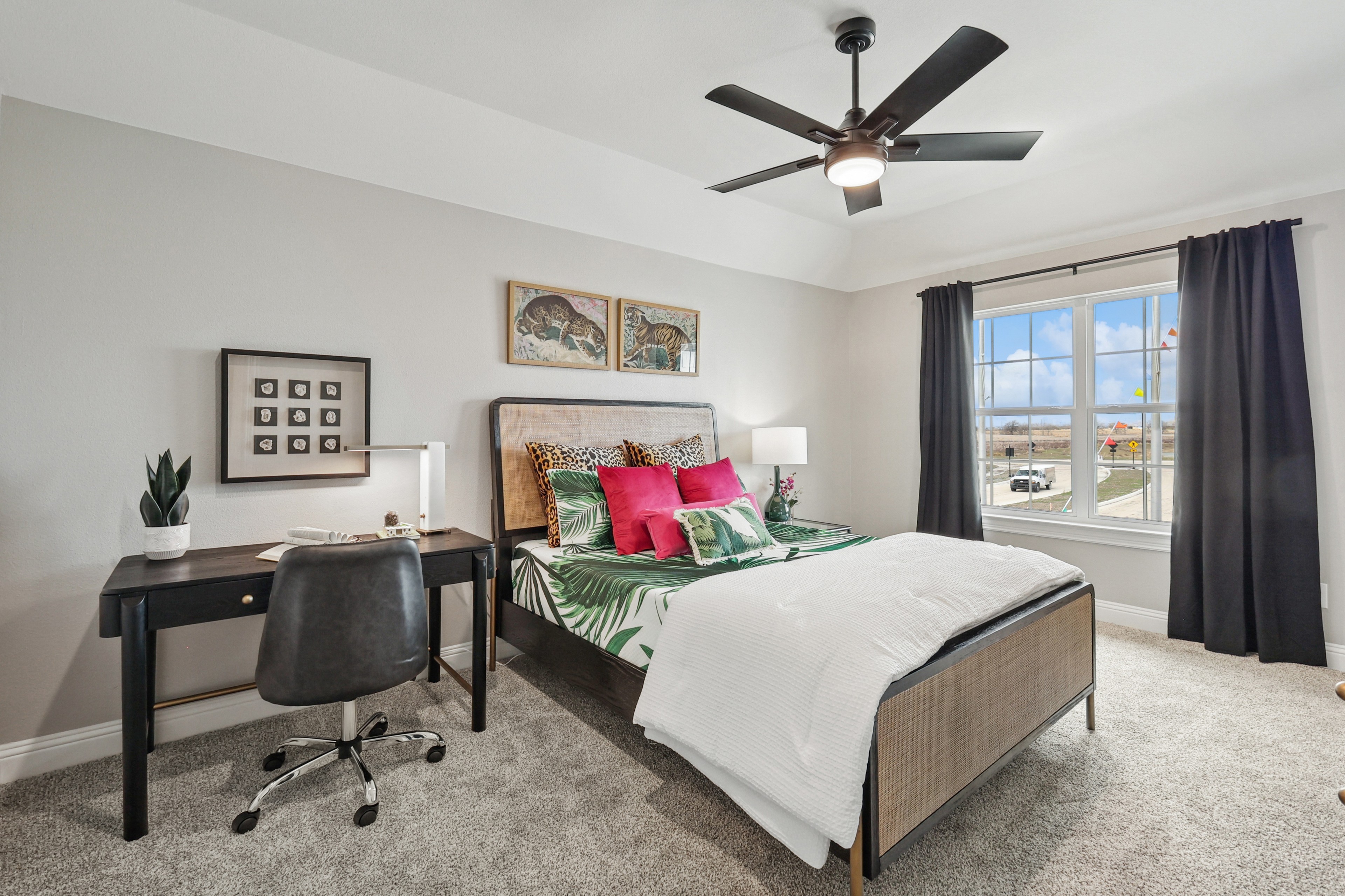 Bedroom with modern decor, large window, tropical bedding, office space in Green Meadows.