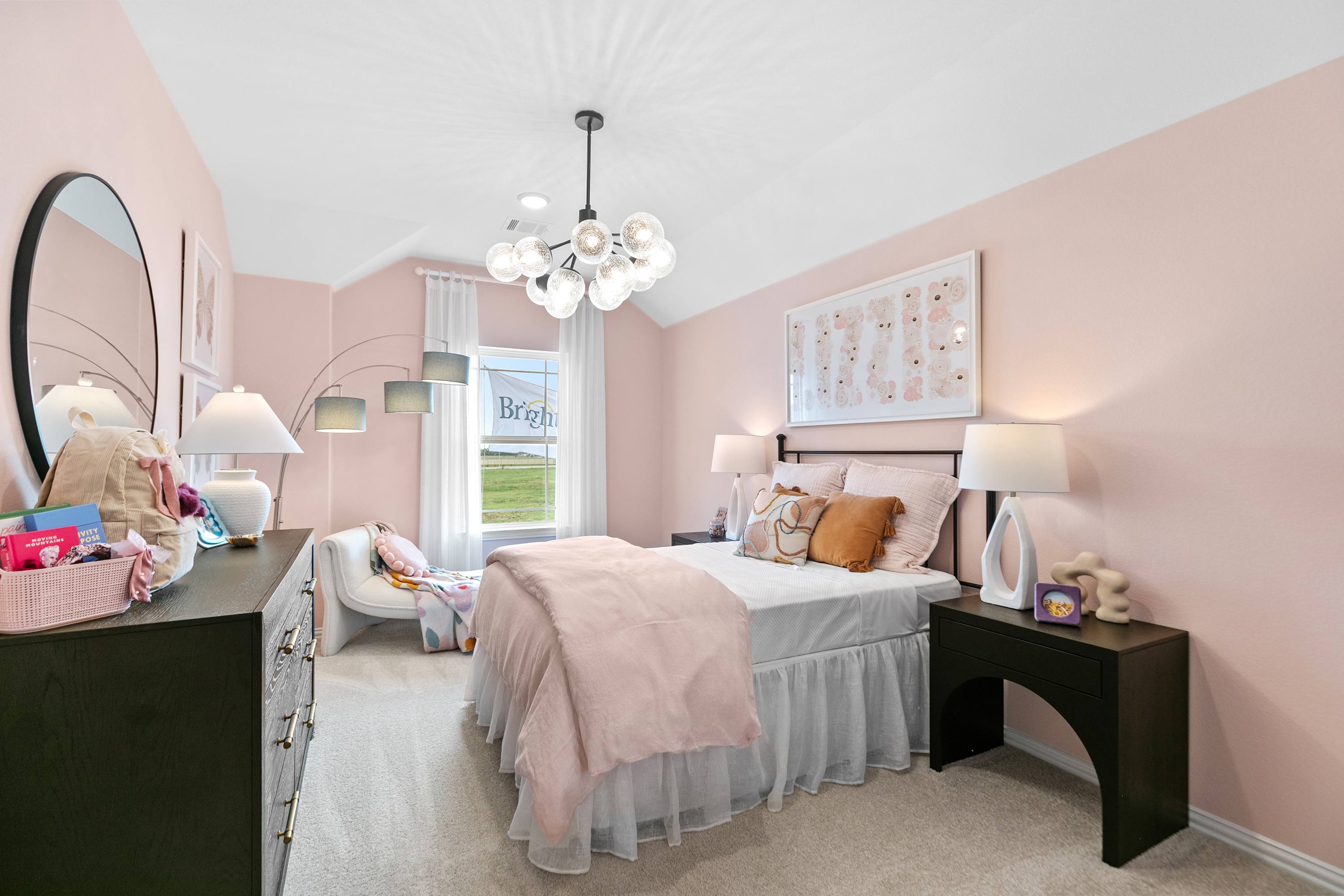 Elegant pink bedroom with modern chandelier, plush bedding, and sleek furniture in River Ranch community.