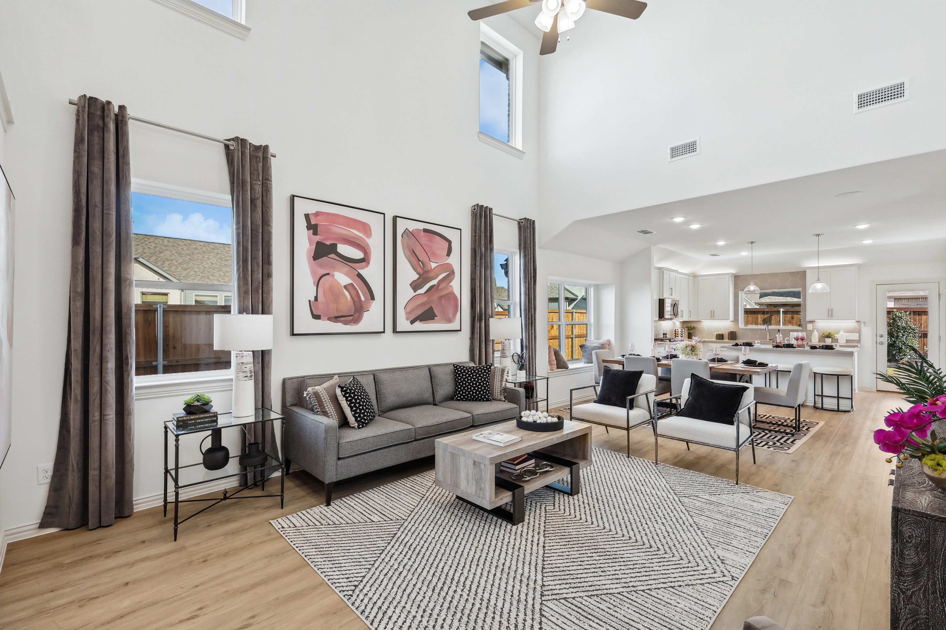 Modern Bel Air Village open-concept living area with high ceilings, hardwood floors, and stylish decor.
