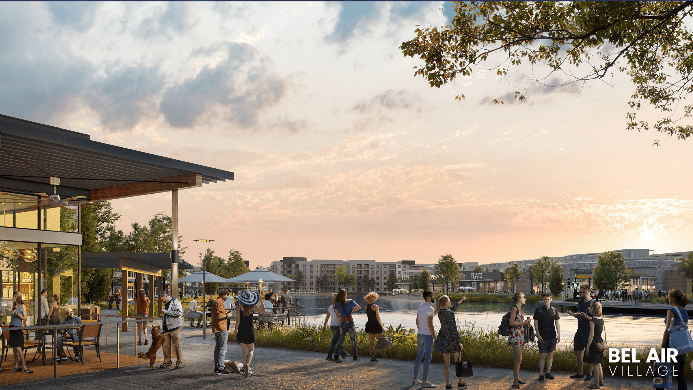 Modern lakeside shopping area at sunset with visitors, glass facade, Bel Air Village location. Scenic, vibrant atmosphere.