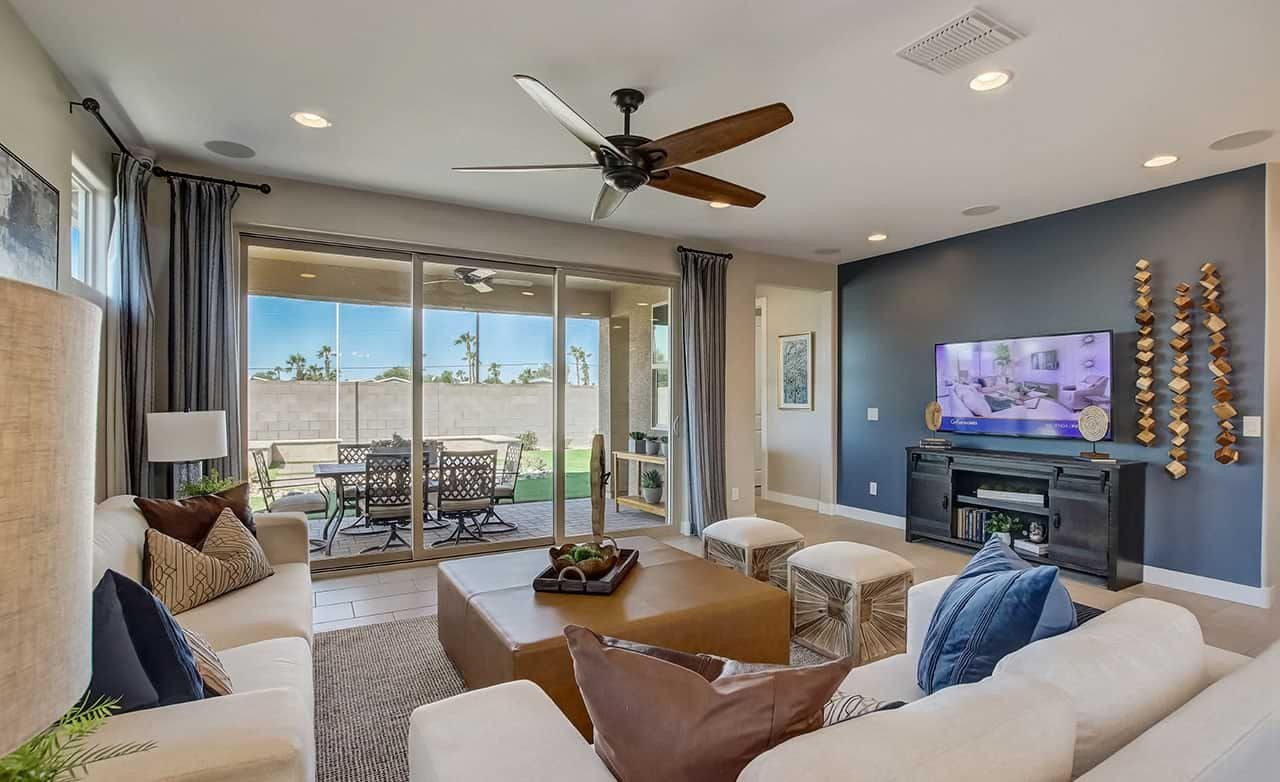 Luxurious living room with ceiling fan, sliding glass doors, modern decor at Castillo, Anderson Parc.