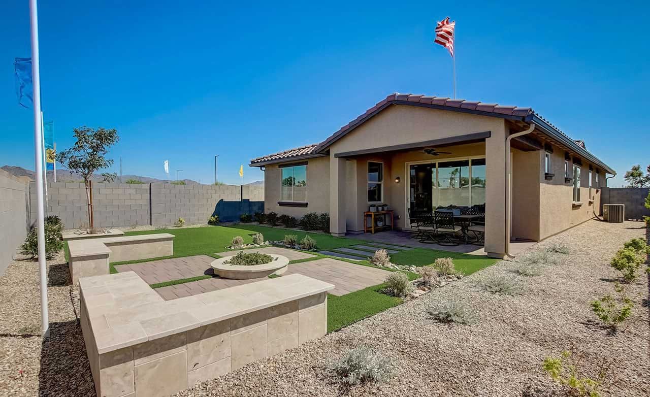 Modern single-story home with stucco exterior, patio, and desert landscaping in Anderson Parc.