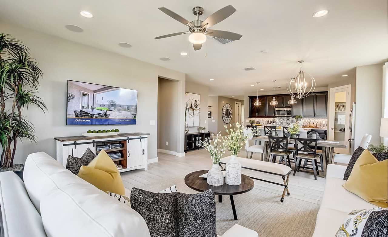 Modern open-plan living room with elegant decor, sleek furniture, and stylish kitchen. Located in Anderson Parc.