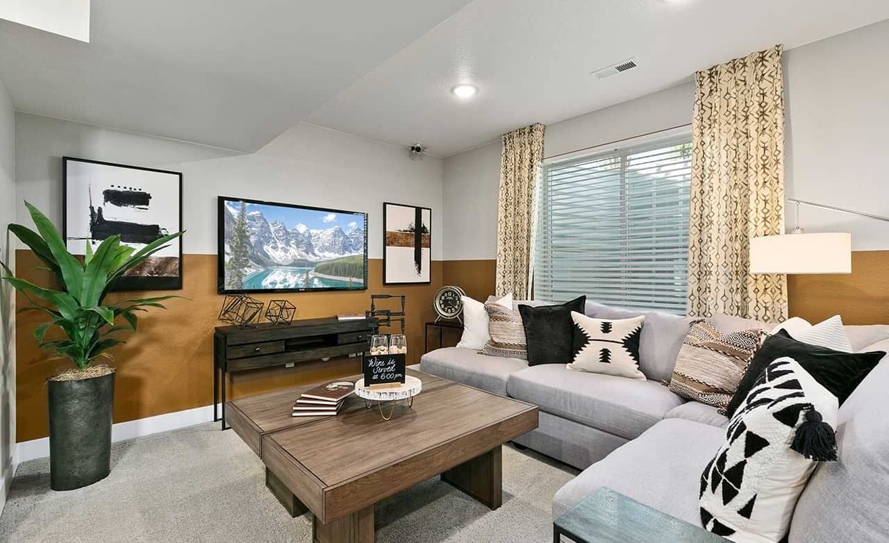 Modern living room, Nordic design, cozy sectional, geometric decor, Trailside on Harmony, Utah. Beige walls, elegant art.